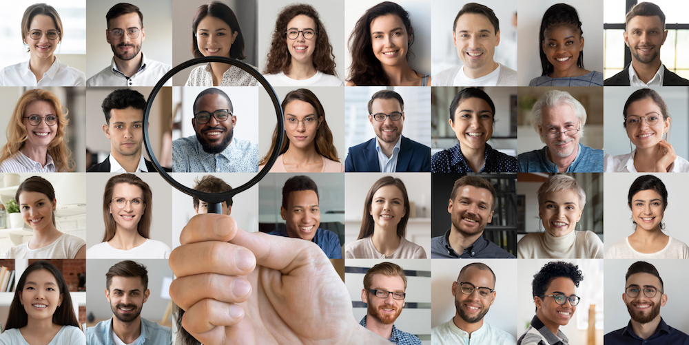 Male employer finding african ethnic job candidate in faces collage